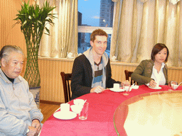 Tim, Miaomiao and Miaomiao`s grandfather in a restaurant in the city center