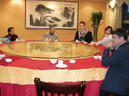 Tim, Miaomiao and Miaomiao`s parents and grandparents in a restaurant in the city center