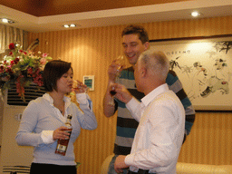 Tim, Miaomiao and Miaomiao`s uncle having drinks in a restaurant in the city center