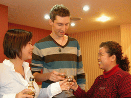 Tim, Miaomiao and a family member having drinks in a restaurant in the city center