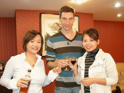 Tim, Miaomiao and Miaomiao`s cousin having drinks in a restaurant in the city center