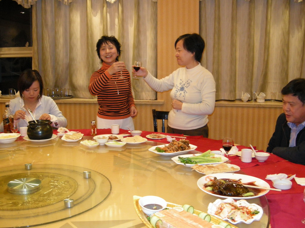 Miaomiao and Miaomiao`s parents and aunt having drinks in a restaurant in the city center