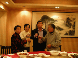 Miaomiao`s parents and grandparents having drinks in a restaurant in the city center