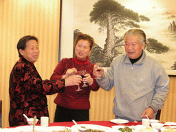 Miaomiao`s grandparents and a family member having drinks in a restaurant in the city center