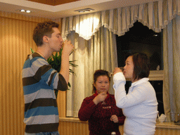 Tim, Miaomiao and a family member having drinks in a restaurant in the city center