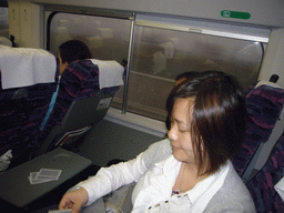 Miaomiao playing cards in the train to Beijing