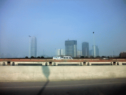 Tall buildings at the Zhengdong New Area, viewed from a car