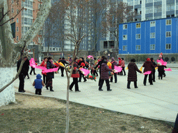 People dancing to celebrate the Chinese New Year at a square in the city center