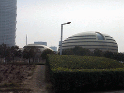 The Henan Art Center and the Greenland Square building at the Zhengdong New Area, viewed from a car