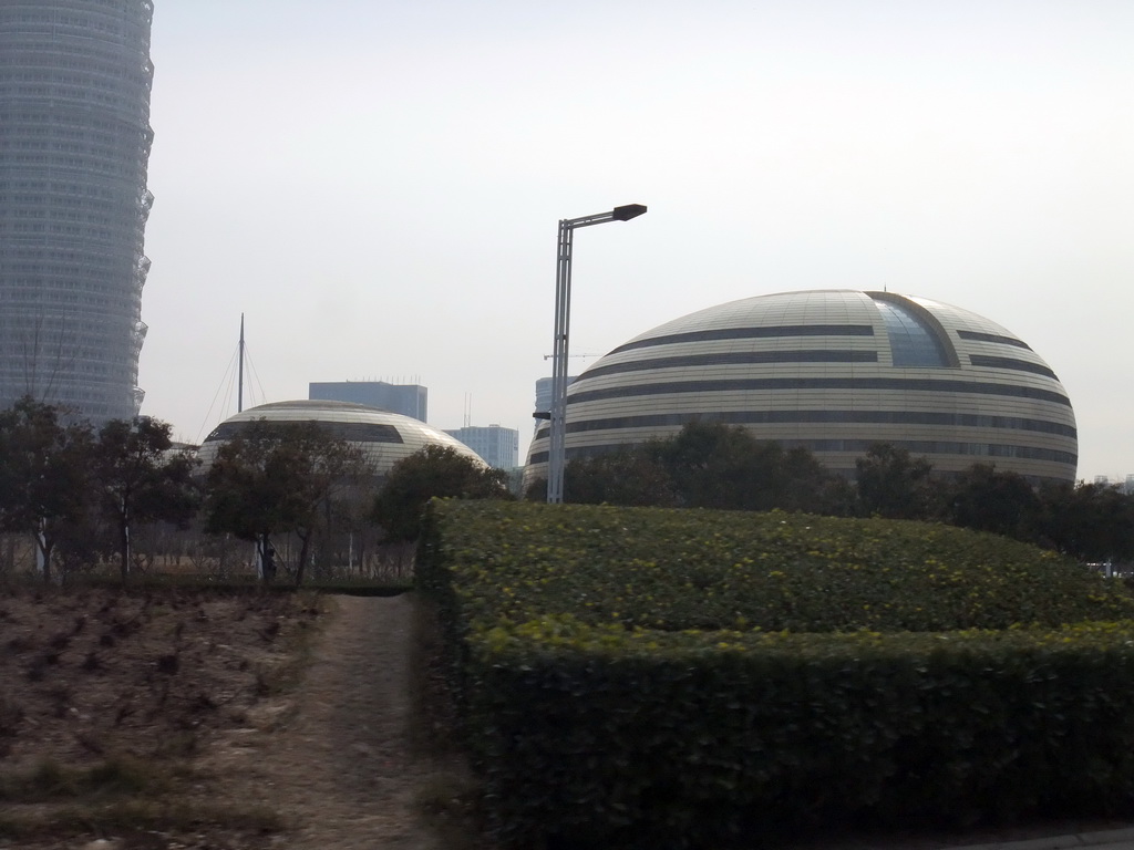 The Henan Art Center and the Greenland Square building at the Zhengdong New Area, viewed from a car