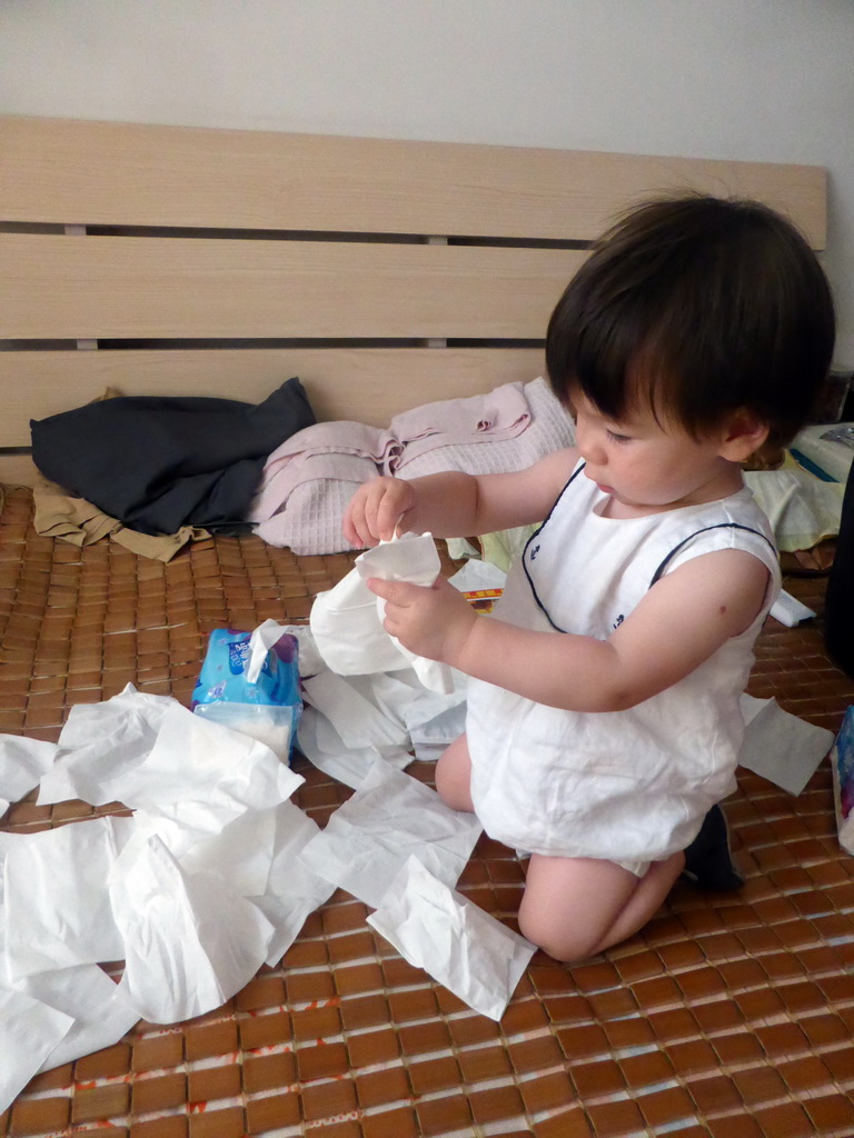 Max playing with tissues at Miaomiao`s grandparents` home at the Nanyangxincun Residential District