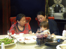 Miaomiao, Max and Miaomiao`s grandmother at the Beijing Dayali restaurant