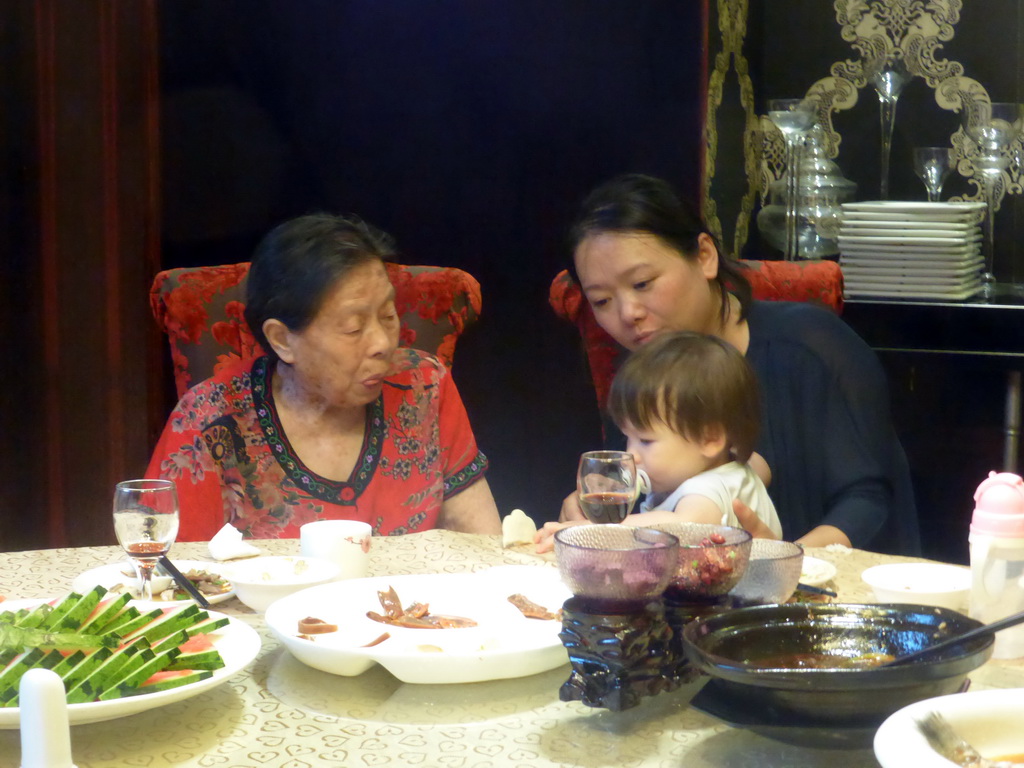 Miaomiao, Max and Miaomiao`s grandmother at the Beijing Dayali restaurant