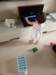 Max playing with electronics at the apartment of Miaomiao`s uncle and aunt