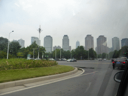 The Zhengzhou International Convention Center with the Greenland Plaza tower, viewed from the car on the Zhongyi West Road