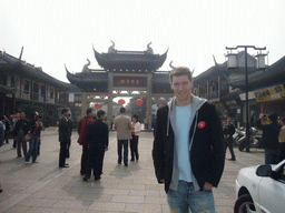 Tim in front of the main entrance gate to the Zhouzhuang Water Town at Quanfu Road