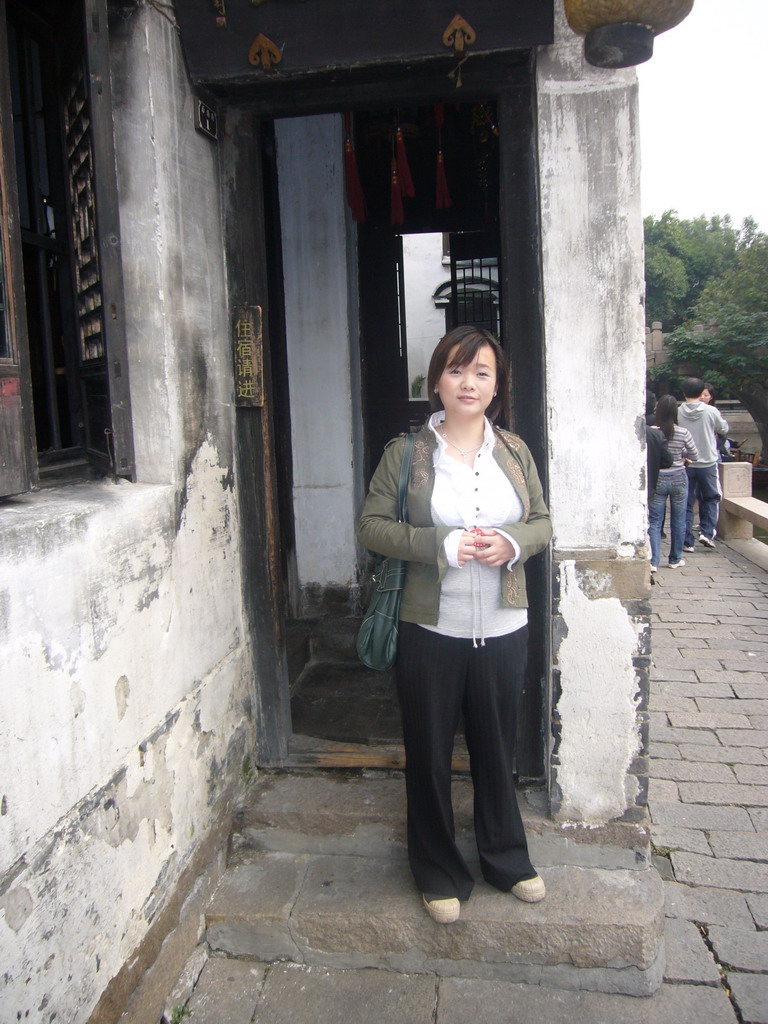 Miaomiao in front of a house at the Zhouzhuang Water Town