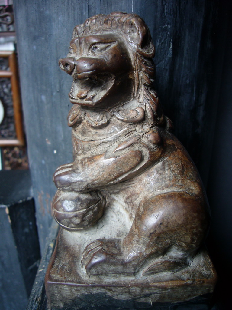 Statuette of a Lion with a ball in a house at the Zhouzhuang Water Town