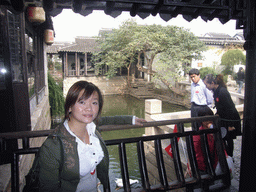 Miaomiao in front of a canal at the Zhouzhuang Water Town