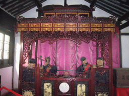 Puppets making music in a house at the Zhouzhuang Water Town