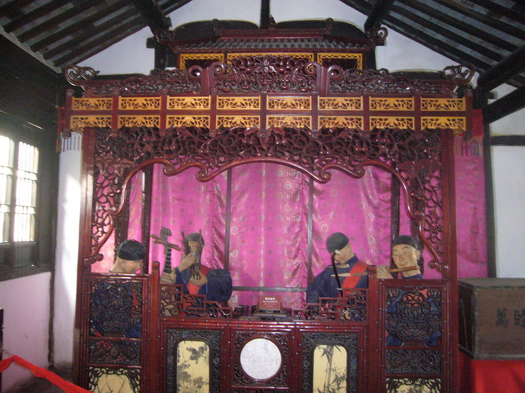 Puppets making music in a house at the Zhouzhuang Water Town