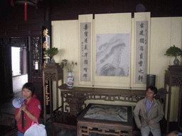 Our tour guide in front of a drawing in a house at the Zhouzhuang Water Town