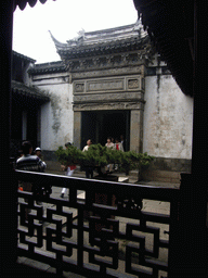 Garden of a house at the Zhouzhuang Water Town, viewed through a window