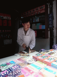 Man selling candy at the Zhouzhuang Water Town