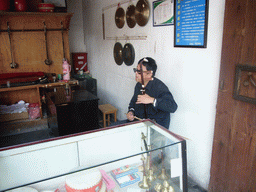 Man playing a musical instrument at the Zhouzhuang Water Town