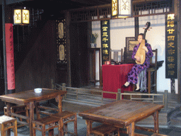 Woman playing a musical instrument at the Zhouzhuang Water Town