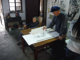 Man doing calligraphy at the Zhouzhuang Water Town