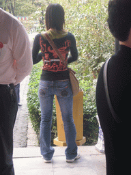 Woman with a funny t-shirt at a temple, on the way back to Shanghai