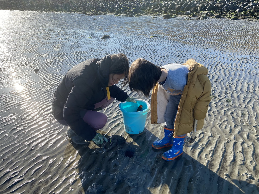 Miaomiao and Max looking for shellfish at the Stille Strand beach