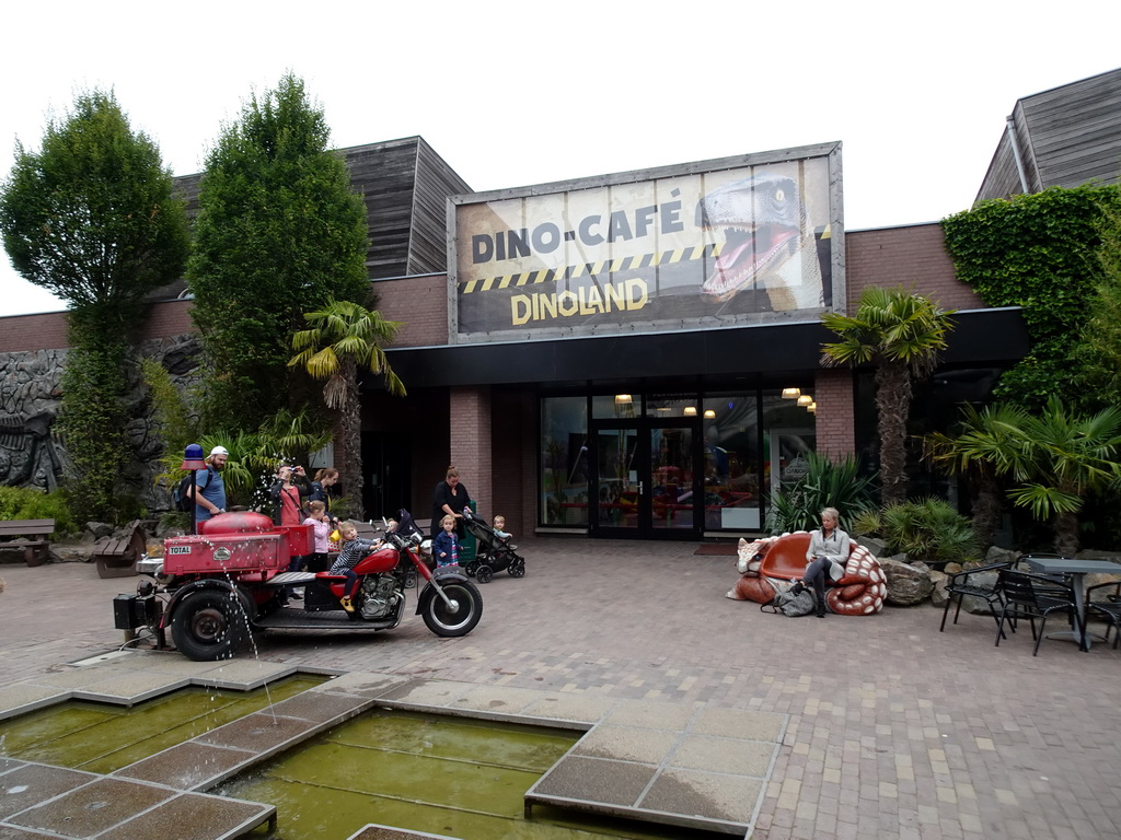 Fountain and the front of the Dino Café at the main square of Dinoland Zwolle