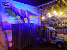 Tyrannosaurus Rex statue and a Triceratops statue in a cage at the T-Rextaurant at Dinoland Zwolle