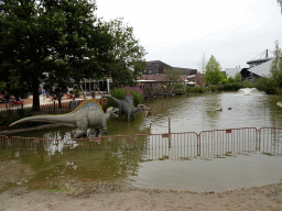 Spinosaur statues in a pond at Dinoland Zwolle