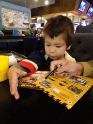 Max making puzzles at the T-Rextaurant at Dinoland Zwolle