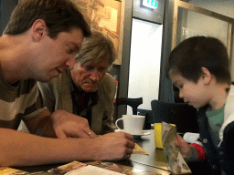 Tim, Max and his grandfather making puzzles at the T-Rextaurant at Dinoland Zwolle