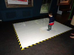 Max playing a projection game at the Playcentre at Dinoland Zwolle