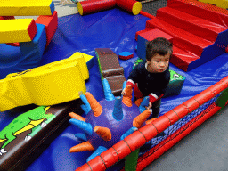 Max playing at the playground at the Playcentre at Dinoland Zwolle